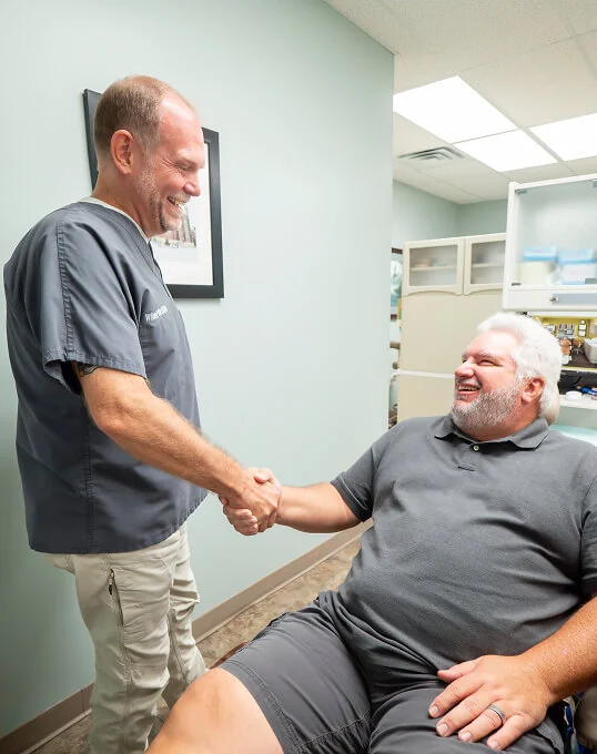 Brandon, MS dentist Dr. Dickey shaking hands with a patient